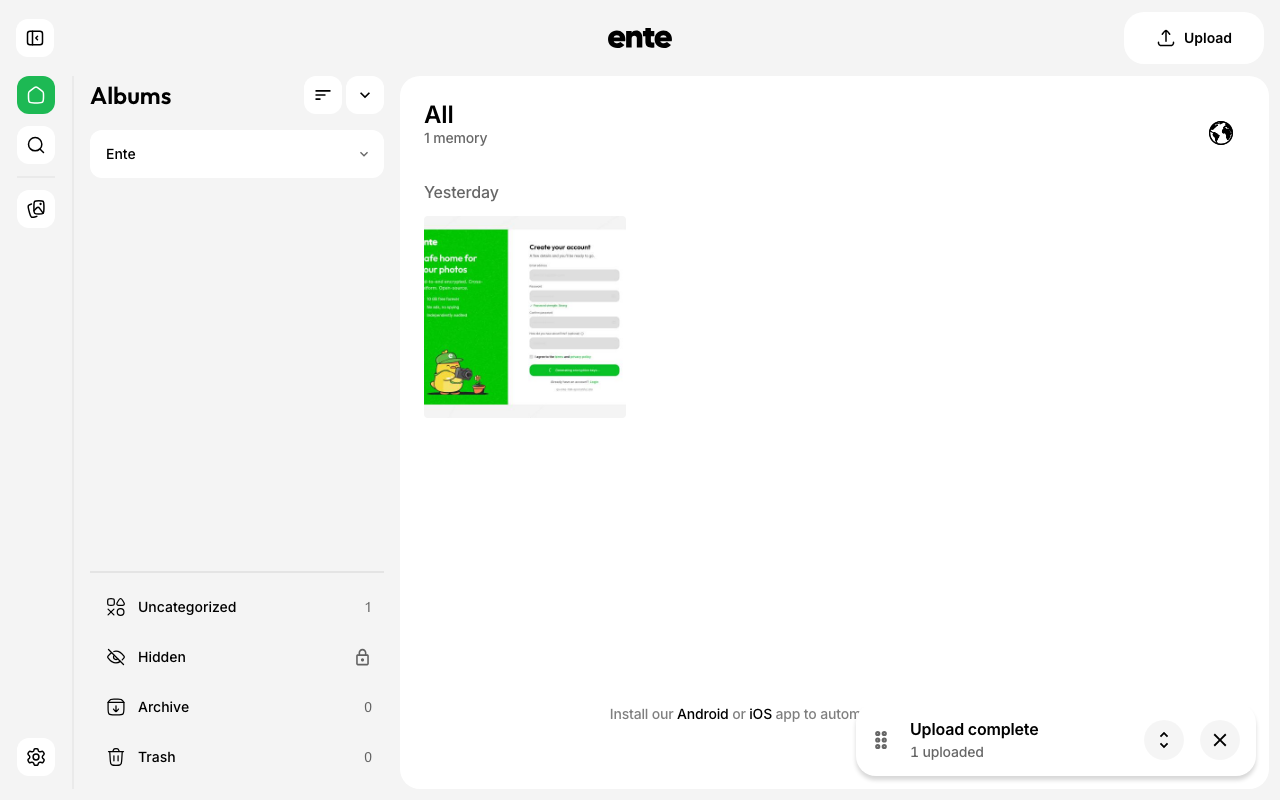 The Ente Photos web app showing a library with one uploaded photo and an upload complete message